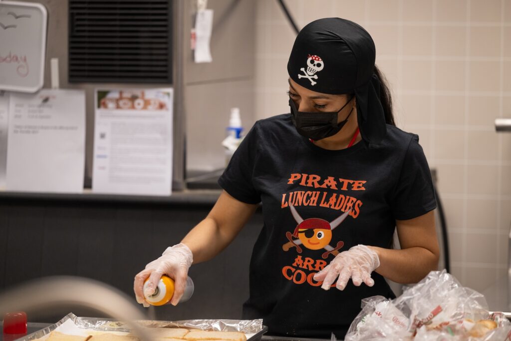A photo of a lunch lady dressed up for Pirates day.