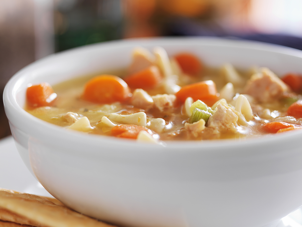 A close up of chicken noodle soup.
