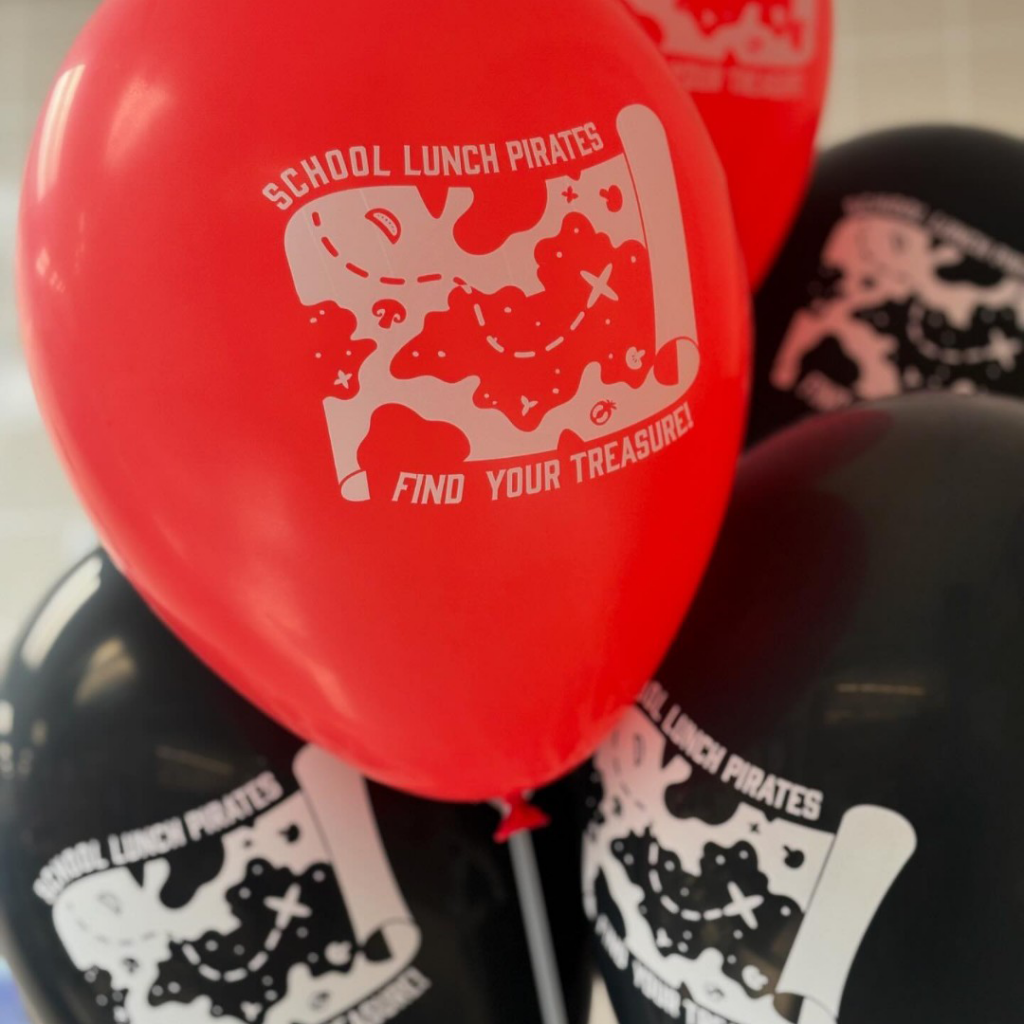 Red and black balloons for pirates day social post.